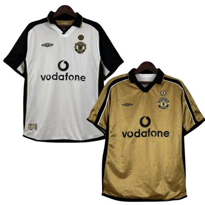 Camisa Dupla Face Retrô Manchester United Umbro 2001/02 100 Anos Masculina Branca e Preta ou Dourada