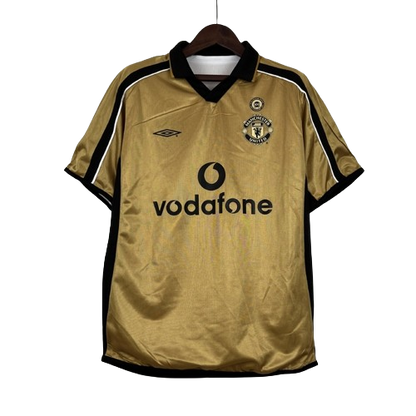 Camisa Dupla Face Retrô Manchester United Umbro 2001/02 100 Anos Masculina Branca e Preta ou Dourada